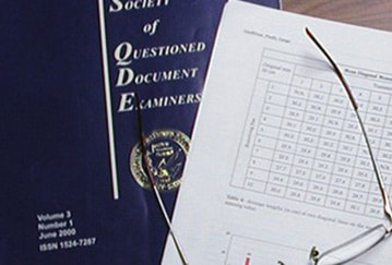 Journal cover and open pages with glasses on top